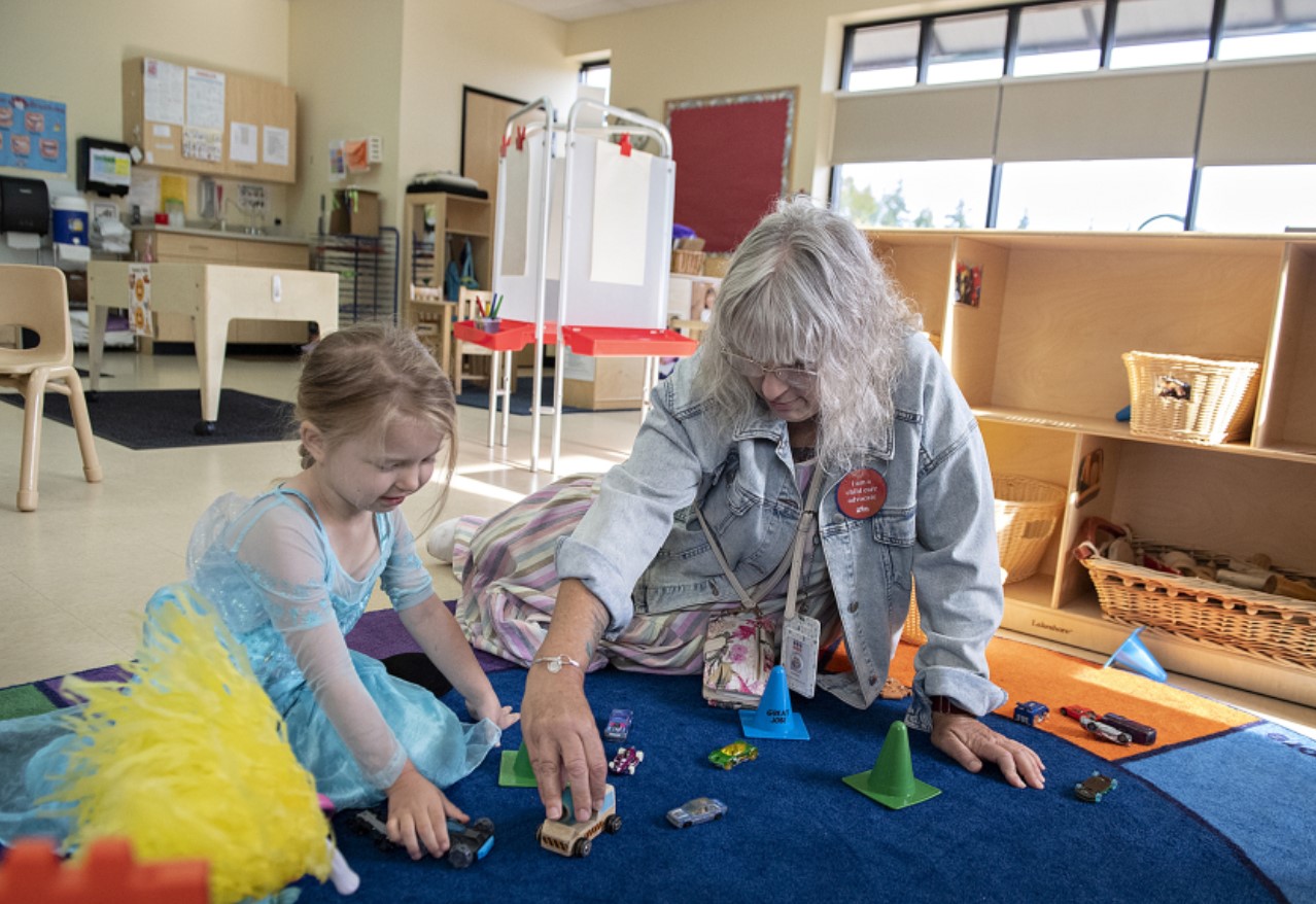 Preschooler Kymber McIntyre, 4, left, enjoys some playtime with Kim Frosh, Child Care Aware Specialist with Educational Service District 112, as she takes a tour of the Educational Opportunities for Children and Families' location in northeast Vancouver in August 2023. (Amanda Cowan/The Columbian)