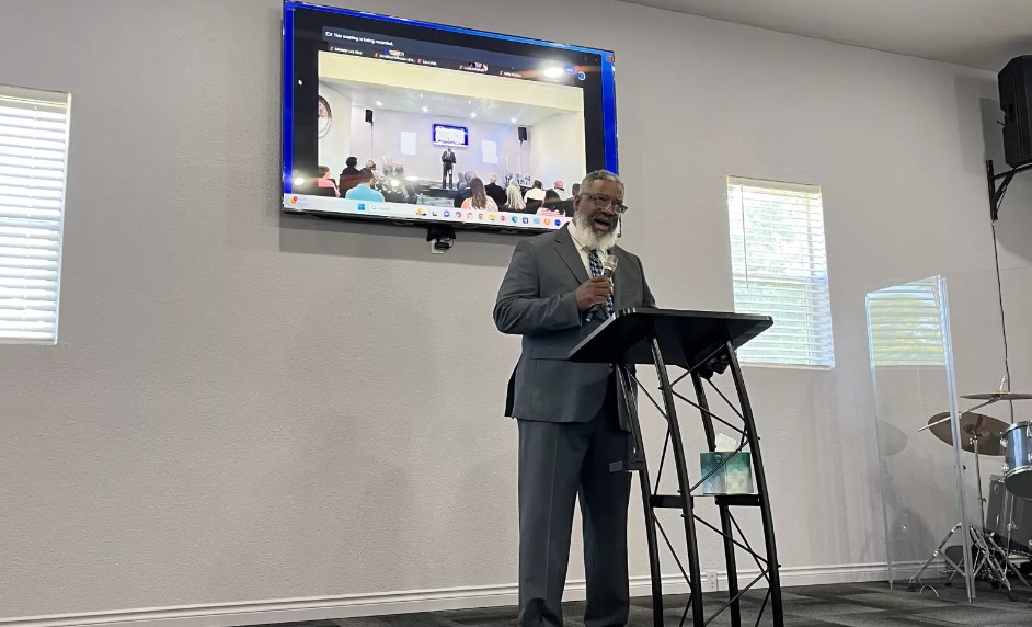 Bishop Dr. Lawrence White speaks to a crowd a news conference on Mon. August 19, 2024 announcing a formal request from a coalition of organizations and individuals to the U.S. Department of Justice for an investigation into the Tacoma Police Department.