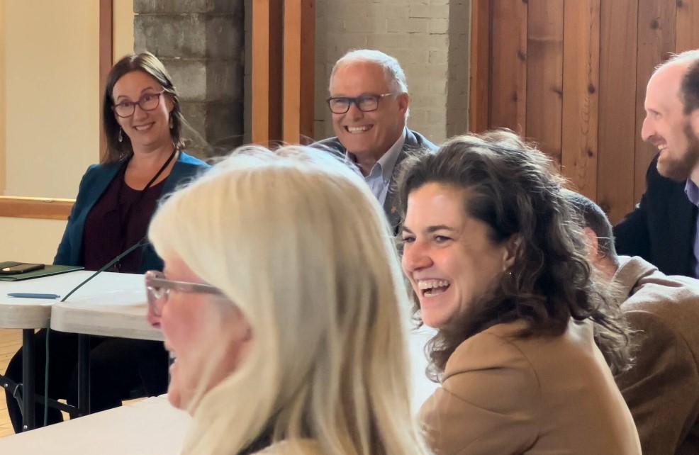 Contributed photo by Jeff Noedel at San Juan Today San Juan County Council Chair Jane Fuller and Gov. Jay Inslee are all smiles at additional funding for local transportation.