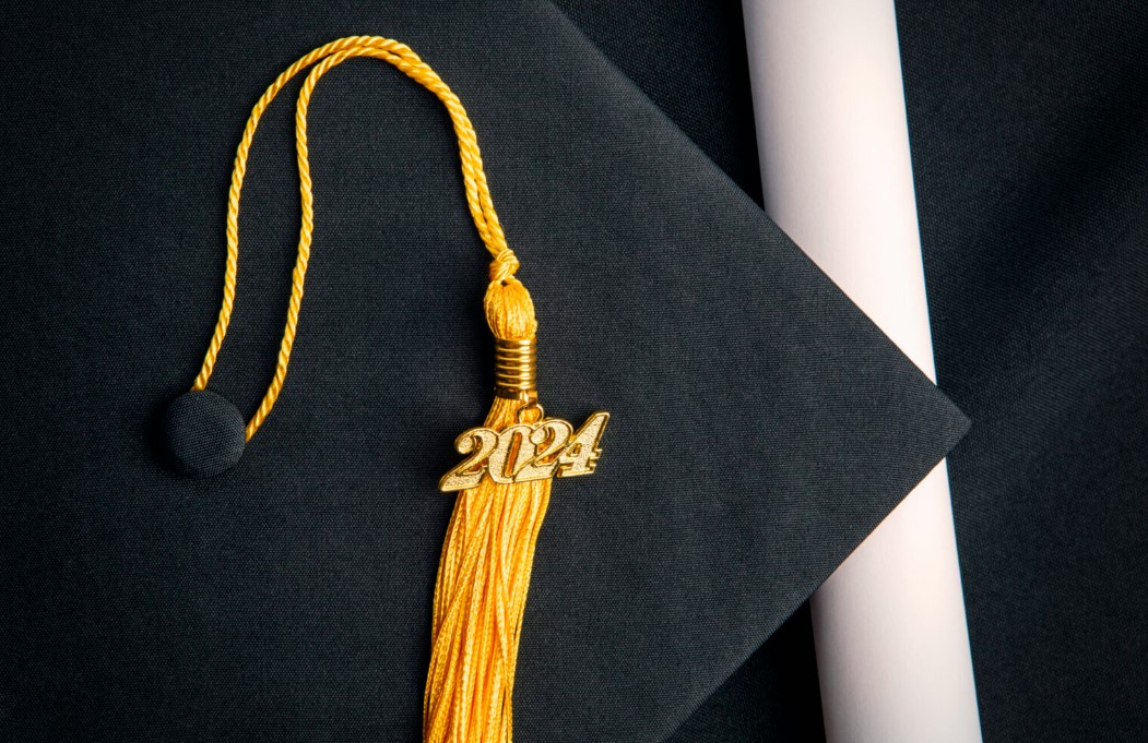 Photo of a graduation cap and tassel with “2024” charm