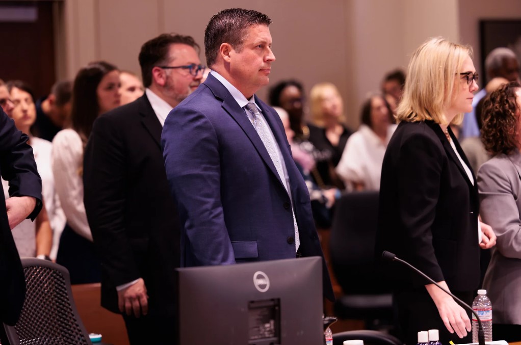 Auburn Police Officer Jeffrey Nelson, center, attends closing arguments in Kent, Wash. Thursday, June 20, 2024. The jury found Nelson guilty of murder, a first in Washington. He may, or may not, be decertified before his criminal case is fully resolved.