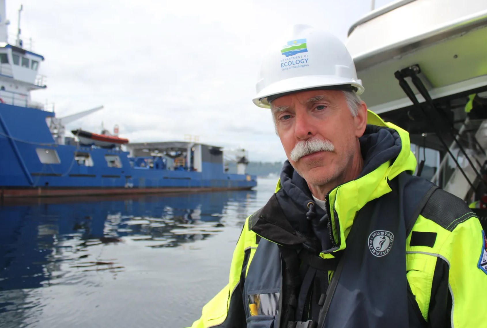 David Byers is a spill-response section manager at the state Department of Ecology, which regulates the oil transport industry operating in state waters. He is seen here during a drill in Port Angeles on Aug. 22. (Gregory Scruggs / The Seattle Times)