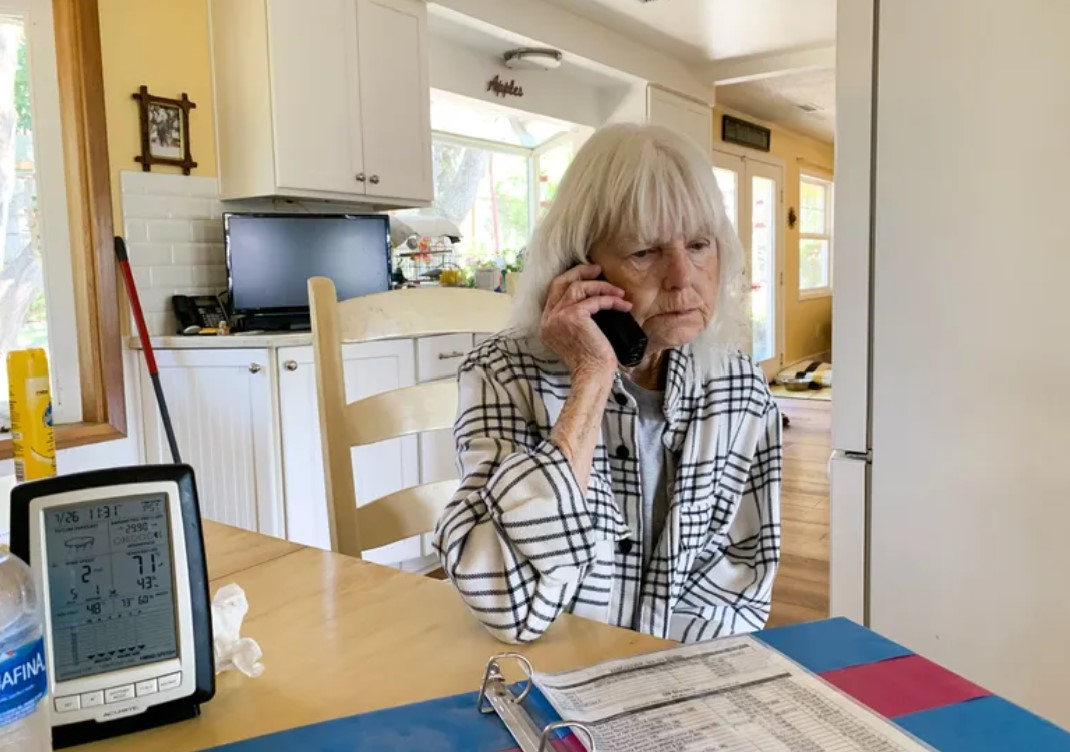 Kathleen Stevens takes a phone call from a woman fleeing domestic violence with nowhere to go. (Alexis Weisend / The Columbian) 