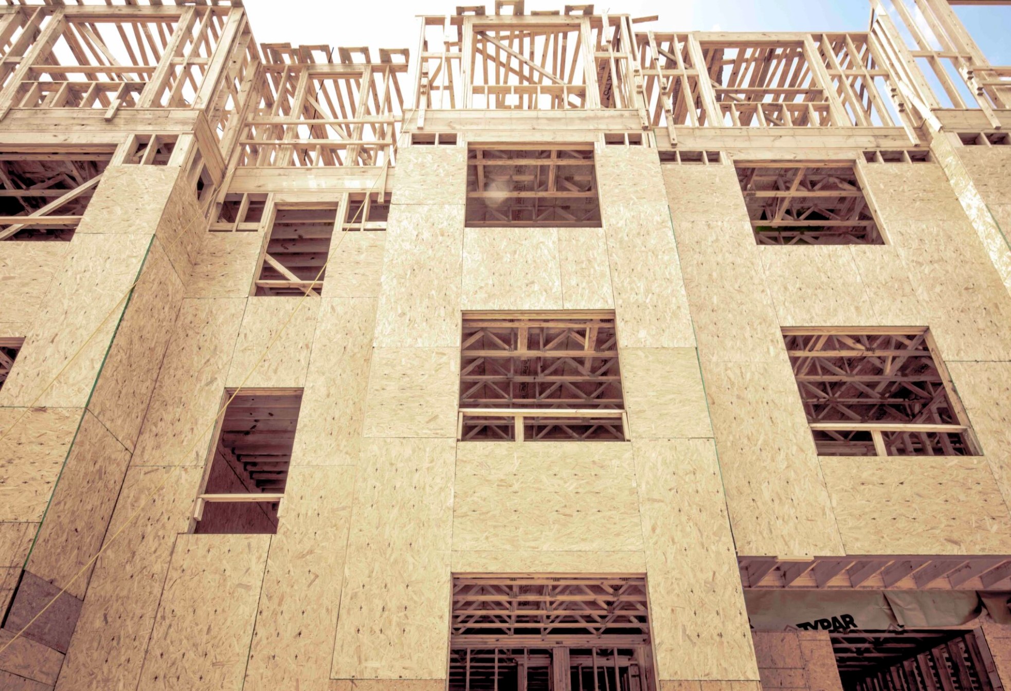 Photo of multifamily housing building under construction