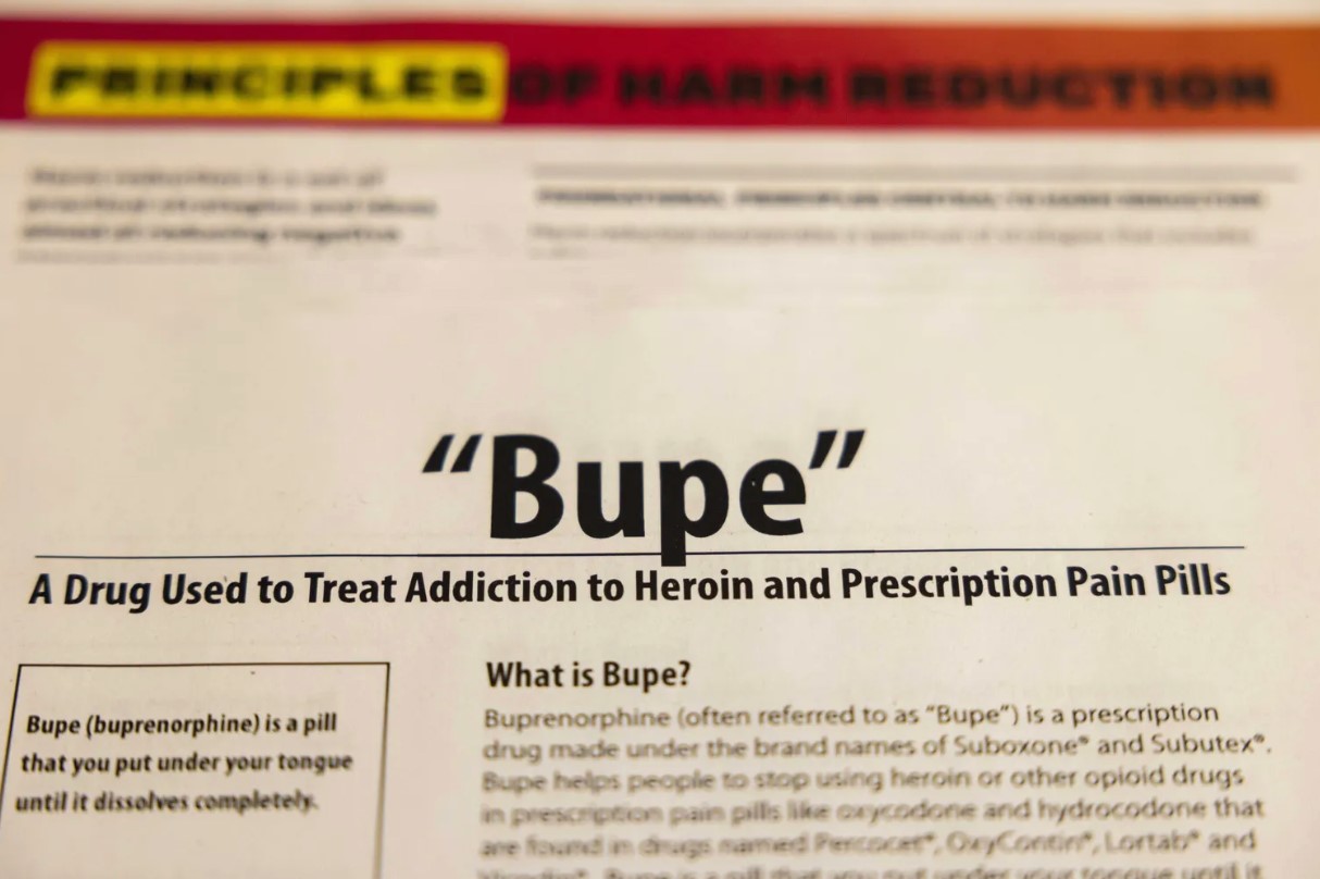 A flyer detailing buprenorphine, a drug that treats opiate use disorder, sits on a table at STEP Clinic in Seattle. (Daniel Kim / The Seattle Times, 2022)