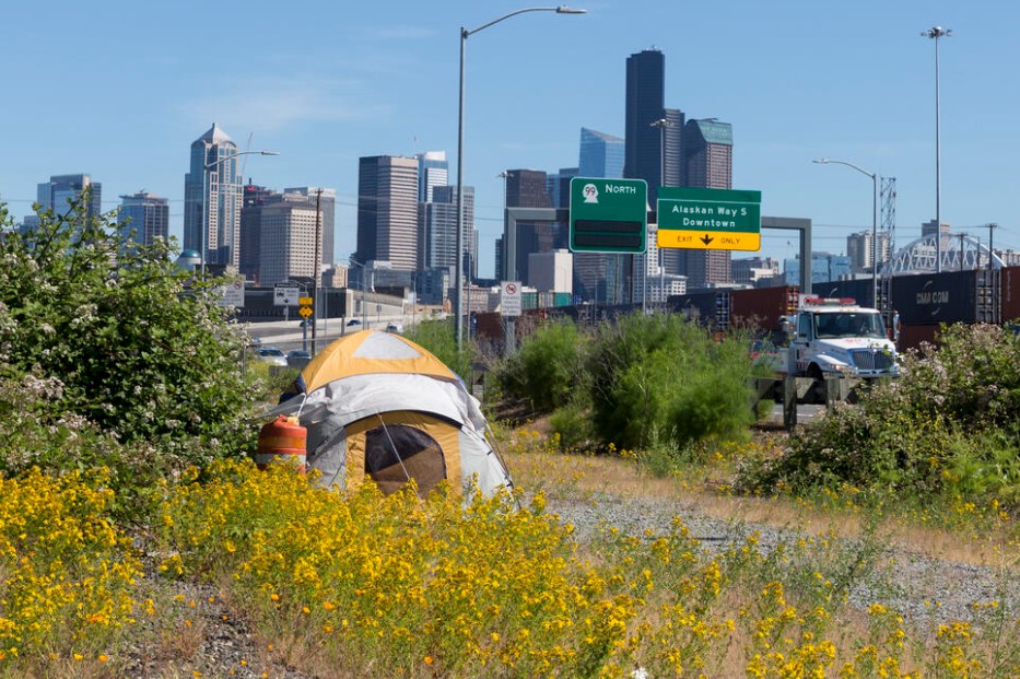 A lone tent is pitched between East Marginal Way South and Highway 99 in the Industrial District in this June 2019 file photo. (Paul Christian Gordon for Cascade PBS)