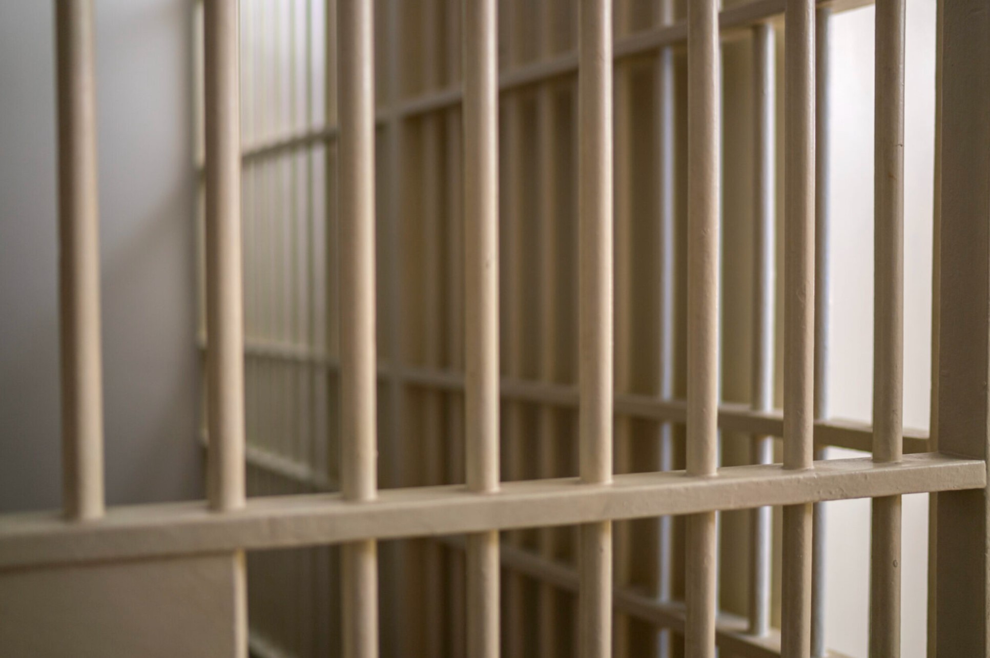 Photo of an empty jail cell.