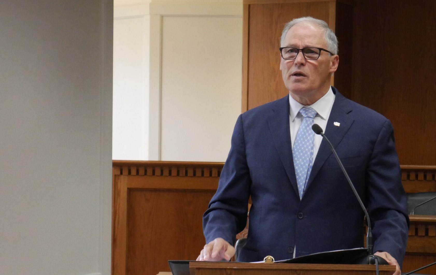 Gov. Jay Inslee speaks to members of the press on Jan. 4, ahead of the 2024 Washington state legislative session. (Bill Lucia/Washington State Standard)