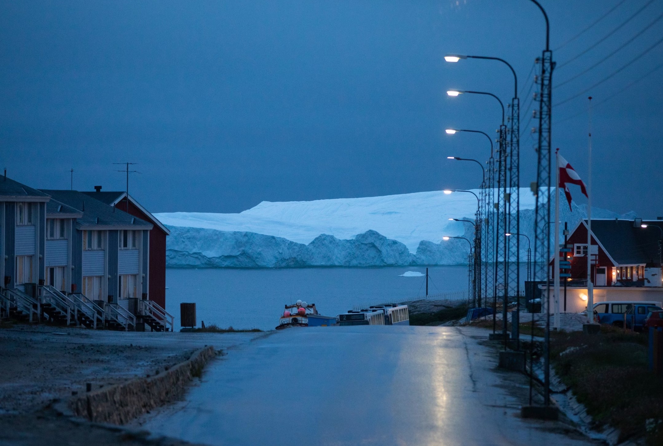 An iceberg floats off the coast of Illulisat, Greenland. Ice sheets in Greenland and Antarctica are melting rapidly, and the risks of drastic melting increase as the Earth heats up. The melting of Greenland's ice sheet is the second-largest contributor to global sea-level rise. (The largest contributor is water expanding as it warms.)