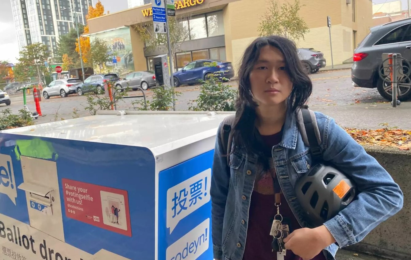 Ember Chow, 24, cast a friend’s ballot at a ballot drop box in the U District on Election Day. 