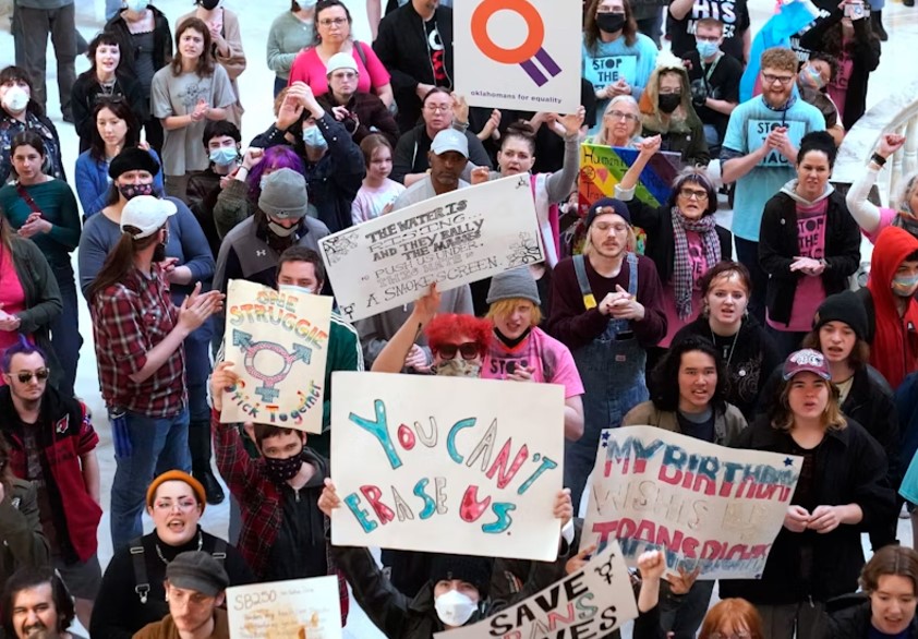 Trans-rights activists protest outside the House chamber at the Oklahoma state capitol before the State of the State address, Feb. 6, 2023, in Oklahoma City. Oklahoma and 25 other states have anti-trans laws on the books.