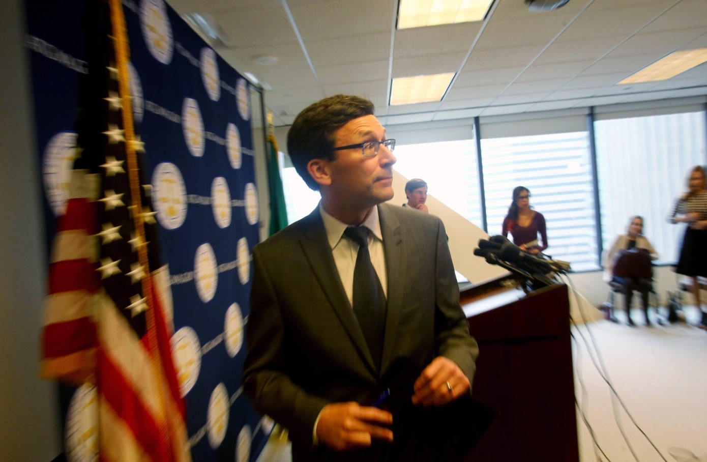 Washington Attorney General Bob Ferguson exits a press conference in 2017 after announcing his decision on potential action regarding an executive order on immigration issued by then-President Donald Trump. March 9, 2017 in Seattle. Ferguson is now governor-elect and says he’s prepared for a new round of sparring when Trump returns to the White House in 2025. (Photo by Karen Ducey/Getty Images)