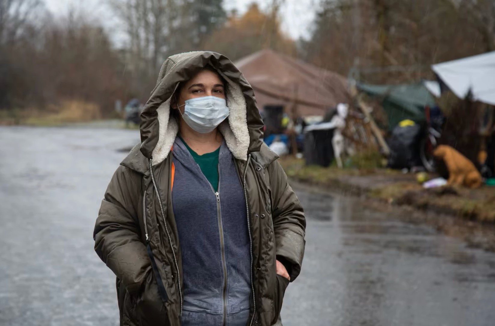 Jamie Spinelli stands at a homeless camp in Clark County in 2021. Spinelli is Vancouver's homeless resources manager.