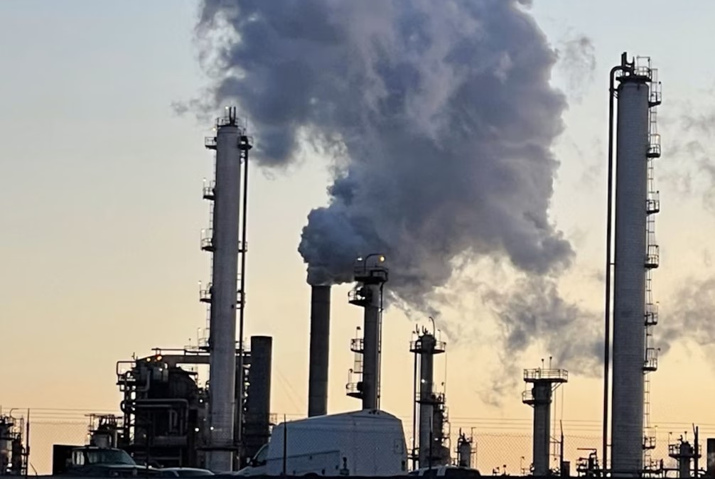 Steam and invisible, heat-trapping carbon dioxide billow from the Marathon Petroleum Corporation refinery in Anacortes, Washington, in April 2022.