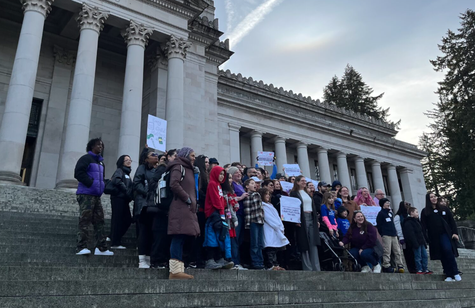 Child care advocates rally on the state Capitol steps on Jan. 22, 2025. (Photo by Laurel Demkovich/Washington State Standard)