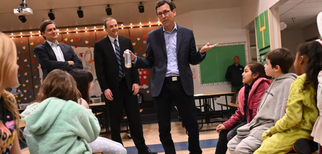 Washington State Treasurer Mike Pellicciotti, left, state Senator-elect Marcus Riccelli and Washington Governor-elect Bob Ferguson visits with Whitman Elementary School students on Friday at Whitman Elementary in Spokane. Ferguson was visiting to talk about free lunch programs for Washington students. (Tyler Tjomsland/The Spokesman-Review)