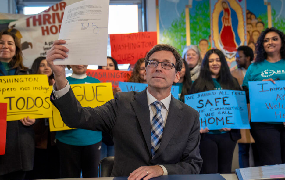 At Seattle’s Centilia Cultural Center on Mon., Jan. 27, 2025, Governor Bob Ferguson presents his executive order creating a Family Separation Rapid Response Team in response to the Trump administration’s immigration crackdown. (M. Scott Brauer/Cascade PBS)