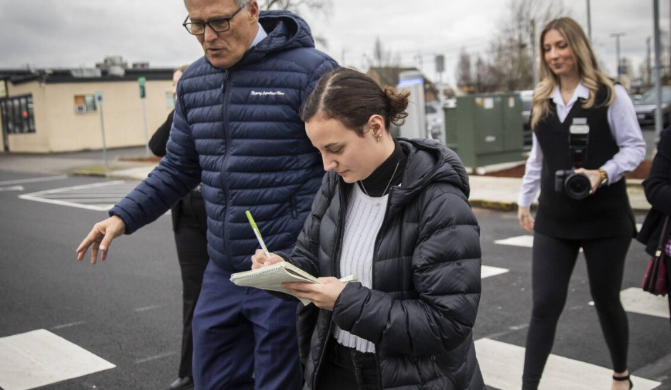 Olivia Vanni / The Herald Former Everett Herald reporter Ta’Leah Van Sistine walks with former Gov. Jay Inslee while taking notes on Feb. 6, 2024, in Marysville. Everett Herald reporter Ta’Leah Van Sistine walks with Governor Jay Inslee and takes notes on Tuesday, Feb. 6, 2024 in Marysville, Washington. (Olivia Vanni / The Herald)