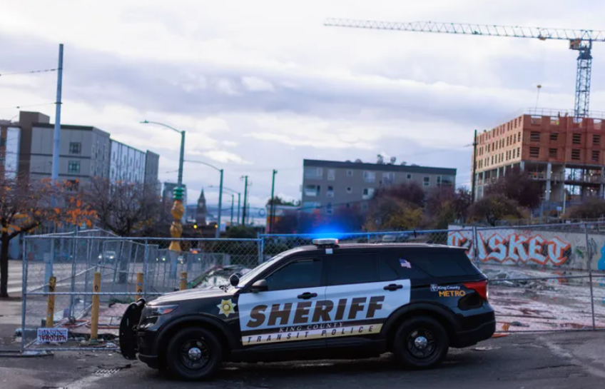 King County sheriff’s deputies work near the intersection of South Jackson Street and 12th Avenue South in Seattle. President Donald Trump’s promises to crack down on undocumented immigrants and begin mass deportations have spurred renewed discussion of a 2019 law passed in Washington that forces local law enforcement agencies to play little part in helping the federal government arrest or deport undocumented immigrants. (Erika Schultz / The Seattle Times, 2024)