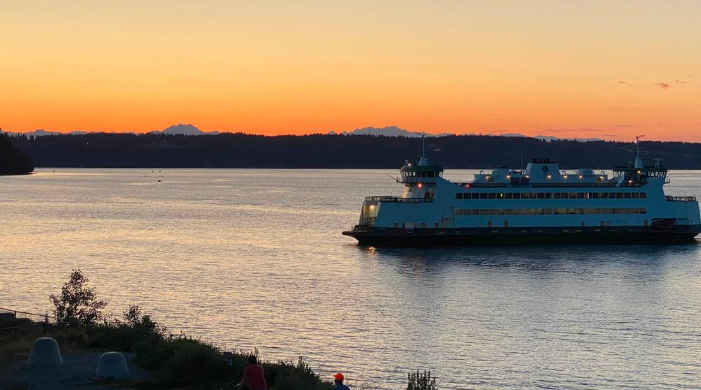 A Washington State Ferry makes its way from Vashon Island to Tacoma at sunset in August 2024. The Olympian