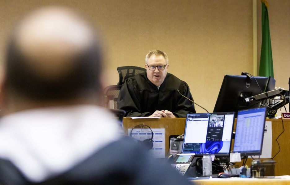 Yakima County Judge Shane Silverthorn discusses a case to a defendant at a Yakima County Jail courtroom on Tuesday, March 25, 2025 in Yakima, Wash. There were no public defenders available to represent the defendant. (Photo by Jake Parrish/InvestigateWest)