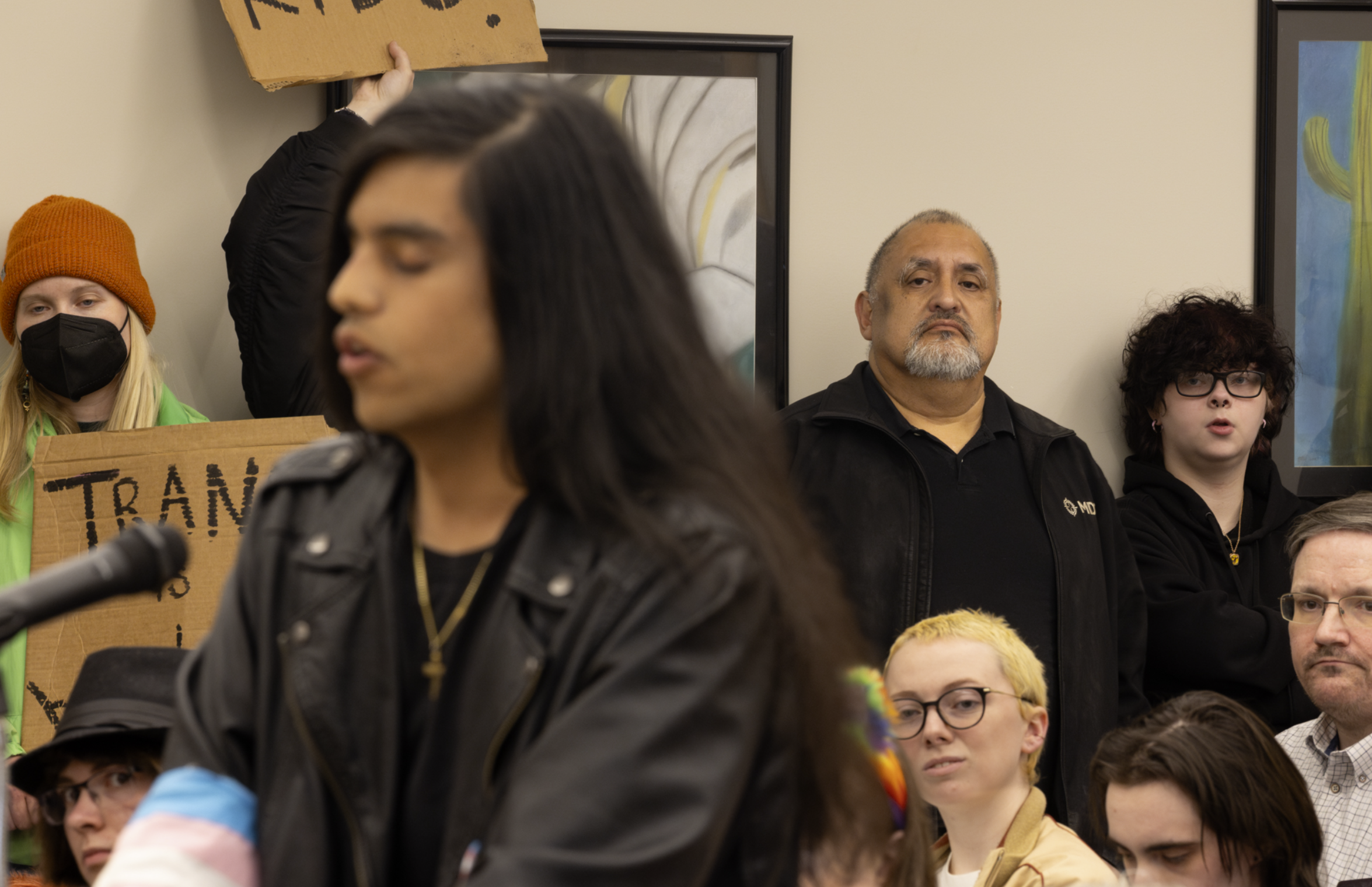 Ricardo Luna watches his transgender daughter Devin Luna speak at a Lynden School Board meeting on May 15. Ricardo attended to support Devin, but still views her as his son. (Santiago Ochoa/Cascadia Daily News)