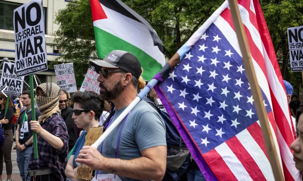 The day after the United States bombed Iran, people protest against war Sunday in downtown Seattle. (Ken Lambert / The Seattle Times)