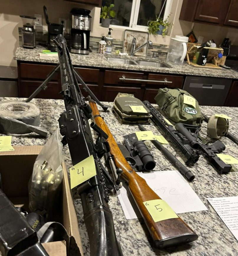 In this undated photo released by the Thurston County Sheriff's Office, a cache of military weaponry is displayed during a raid at a home in Lacey.