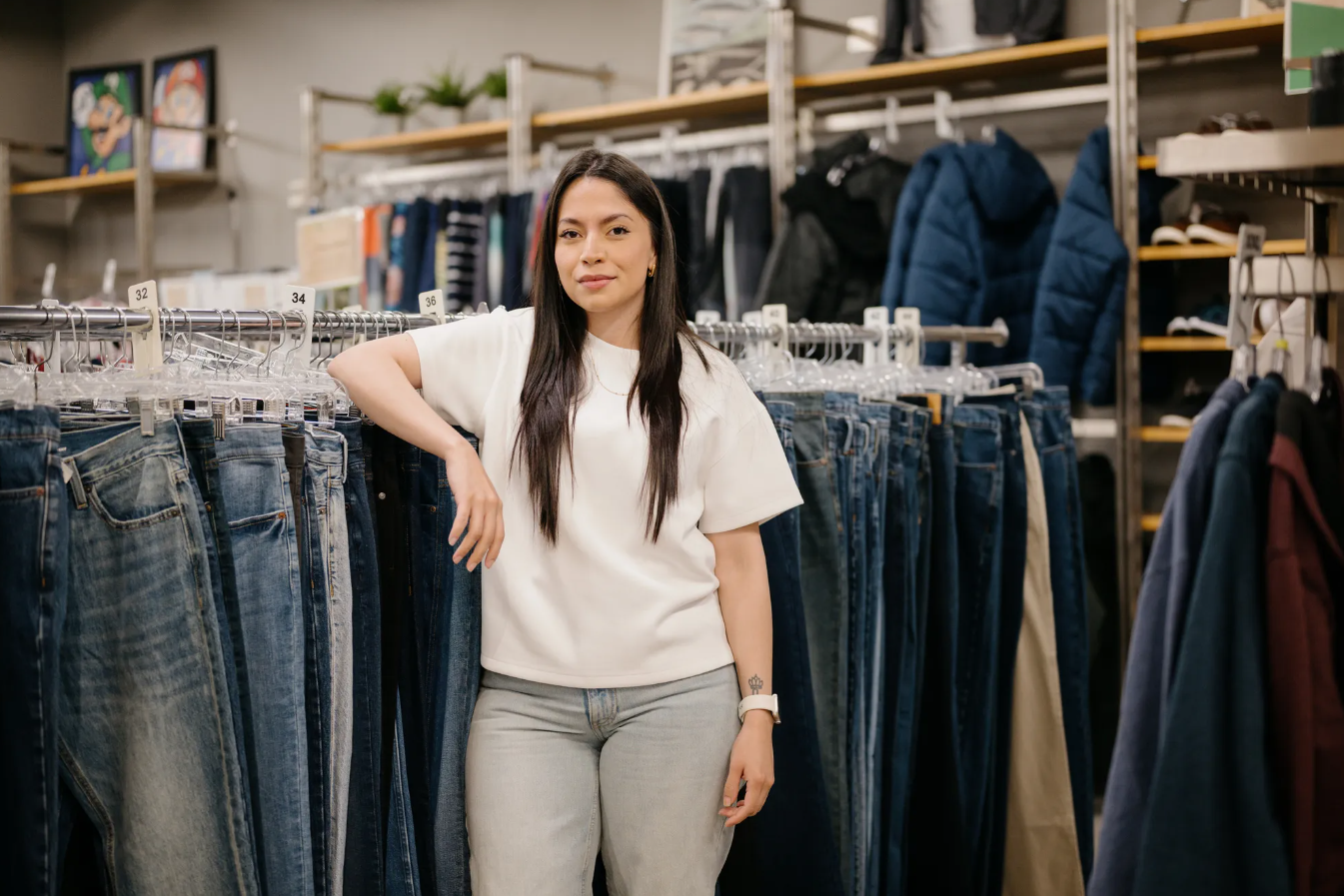 Shirley Mendez, an alum of the Treehouse program, poses for a portrait in the Treehouse Store in Seattle, where she got school supplies, books and clothing that made an impact on her health and success, on Wednesday, June 11, 2025.