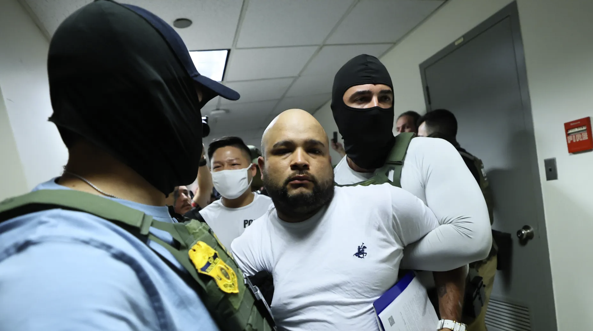 Masked cfederal agents detain a man after a court hearing in immigration court at the Jacob K. Javitz Federal Building on July 03, 2025 in New York City. Photo: Michael M. Santiago/Getty Images