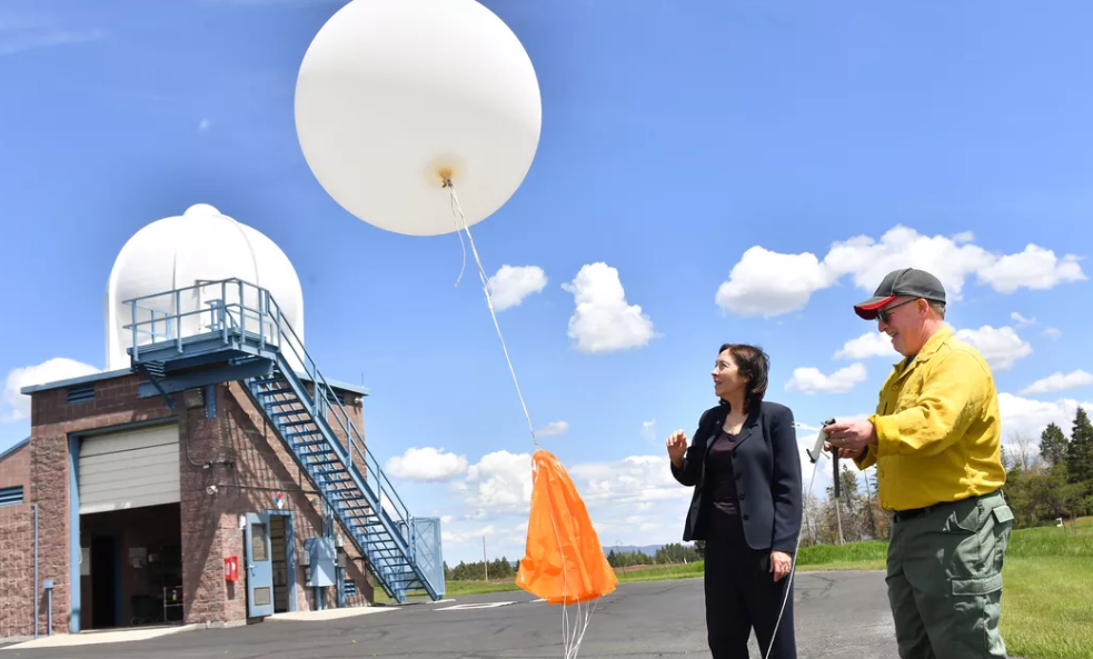 Senator Maria Cantwell, left, releases a weather balloon with Jon Fox, an incident meteorologist during a visit to the National Weather Service’s Spokane Forecasting Office on June 1, 2022. Cantwell on Wednesday questioned President Donald Trump’s nominee to lead the National Oceanic and Atmospheric Administration about recent cuts to the National Weather Service. (TYLER TJOMSLAND/The Spokesman-Review)