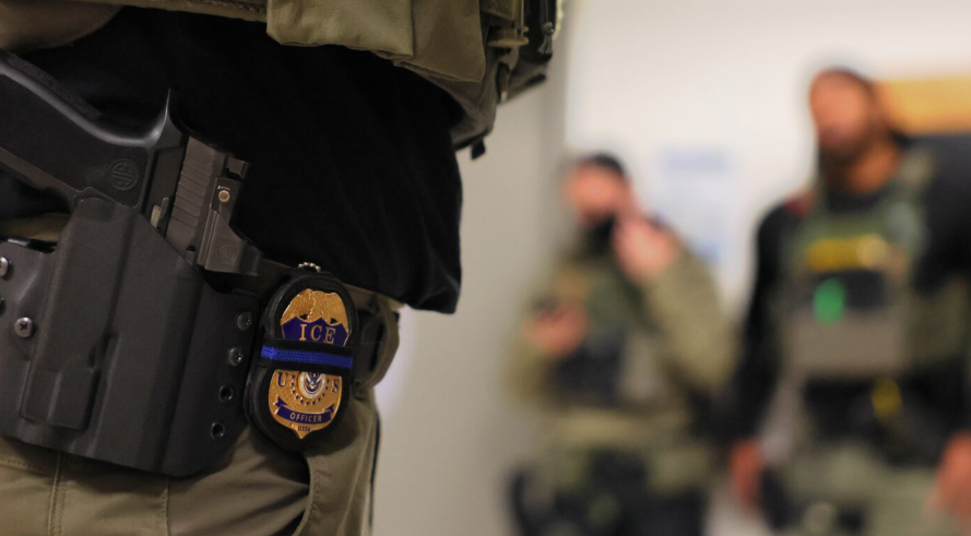 An Immigration and Customs Enforcement officer’s badge is seen as federal agents patrol the halls of immigration court in New York City on June 10, 2025. (Photo by Michael M. Santiago/Getty Images)