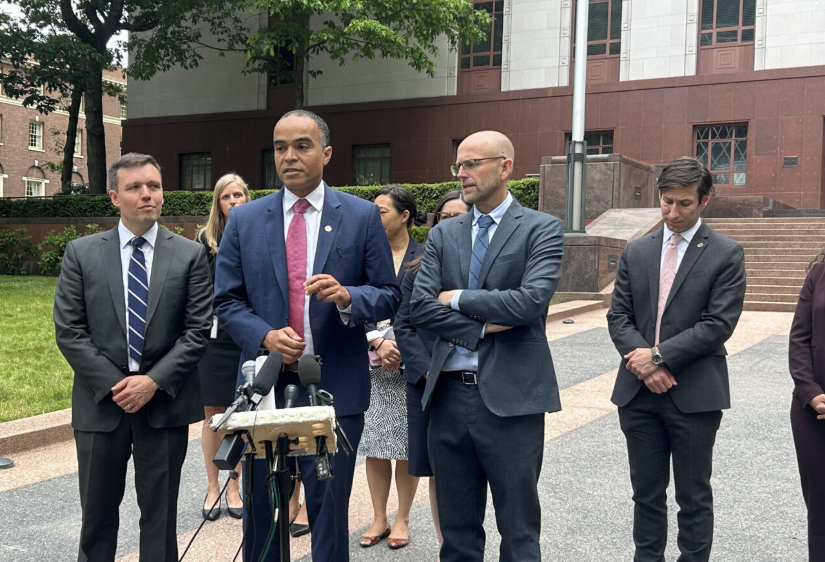 Washington Attorney General Nick Brown, center, speaks to reporters alongside Solicitor General Noah Purcell, left, and Northwest Immigrant Rights Project Legal Director Matt Adams, right, outside a Seattle courthouse where federal appeals court judges heard arguments over President Donald Trump's executive order on birthright citizenship on June 4, 2025. (Photo by Jake Goldstein-Street/Washington State Standard)