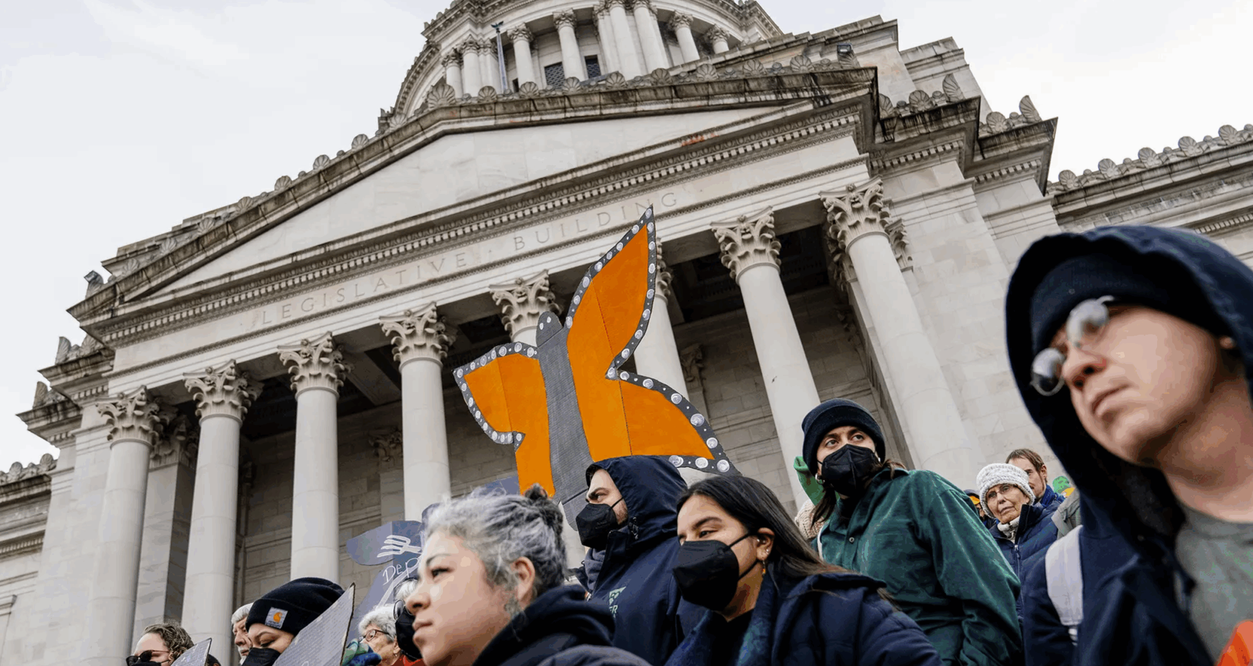 Immigration activists gather on the Washington State Capitol steps during Washington Immigrant Solidarity Network (WAISN) Immigrant and Refugee Advocacy Day in Olympia on Thurs., Jan. 30, 2025. (M. Scott Brauer/Cascade PBS)