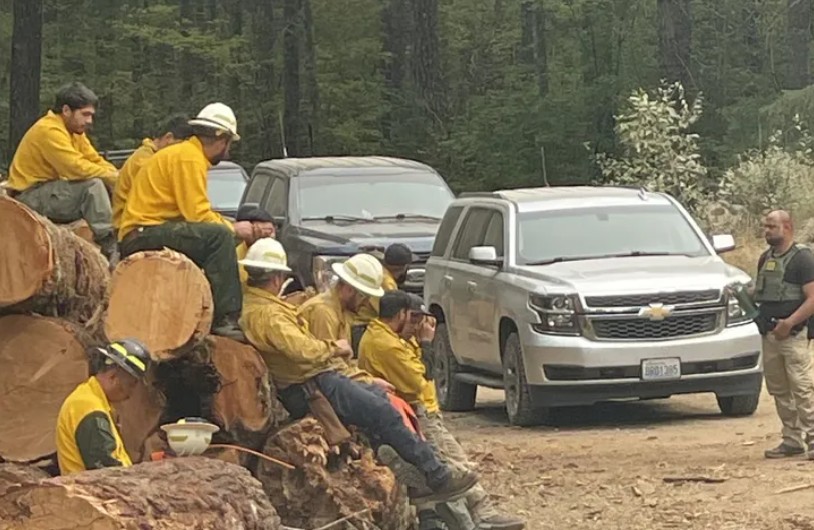 Federal law enforcement agents, including some with the U.S. Border Patrol, arrived at a site in Mason County on Wednesday afternoon to demand identification from private contracting crews fighting the Bear Gulch fire near Lake Cushman. (Courtesy of fire crew)