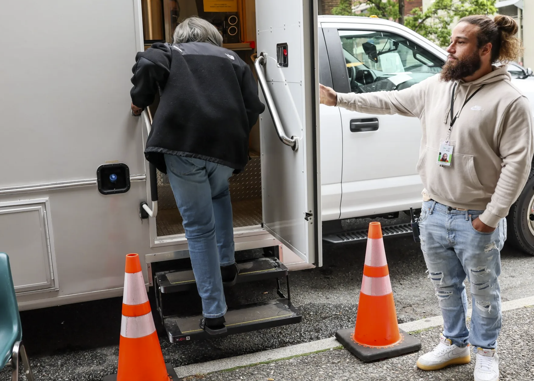 A mobile treatment vehicle run by Evergreen Treatment Services, one of the largest homeless outreach providers in King County, is set up outside a Public Health – Seattle & King County clinic in Belltown. Both... (Kevin Clark / The Seattle Times)