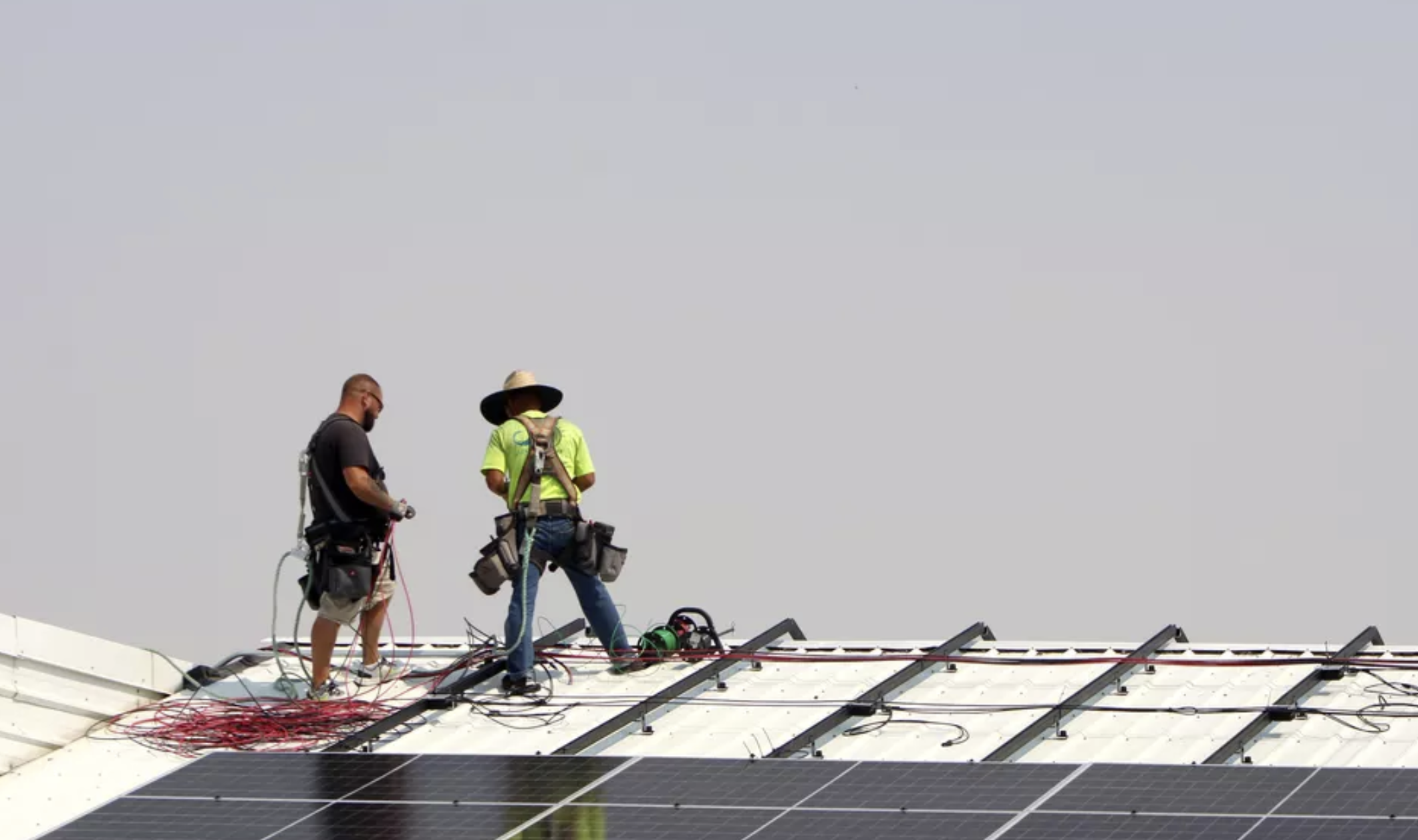 Workers put solar panels in Harrington School District, Aug. 13, 2025. This part of a joint project put together by organizations in Eastern Washington to help rural schools save money. (Monica Carrillo-Casas/The Spokesman-Review)