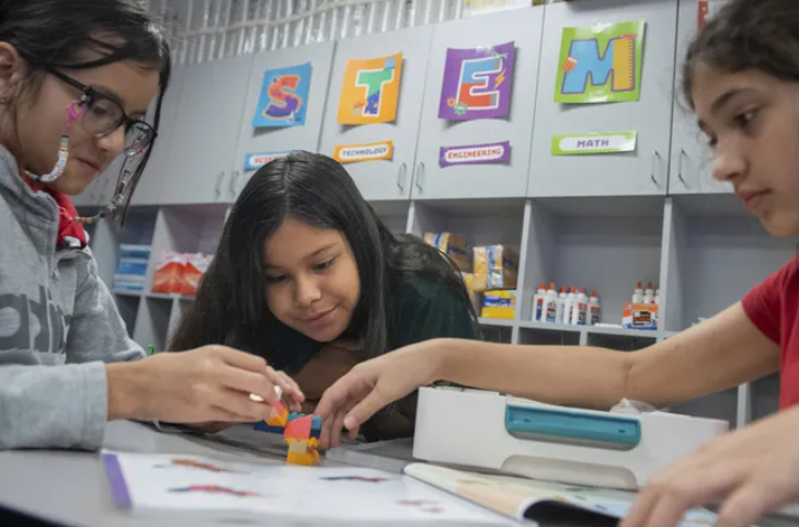 Students build a dragon out of LEGO bricks during class at Lively Elementary on Thursday, Aug. 21, 2025, in Irving, Texas. (AP Photo/Ronaldo Bolaños) (Ronaldo Bolaños / AP)