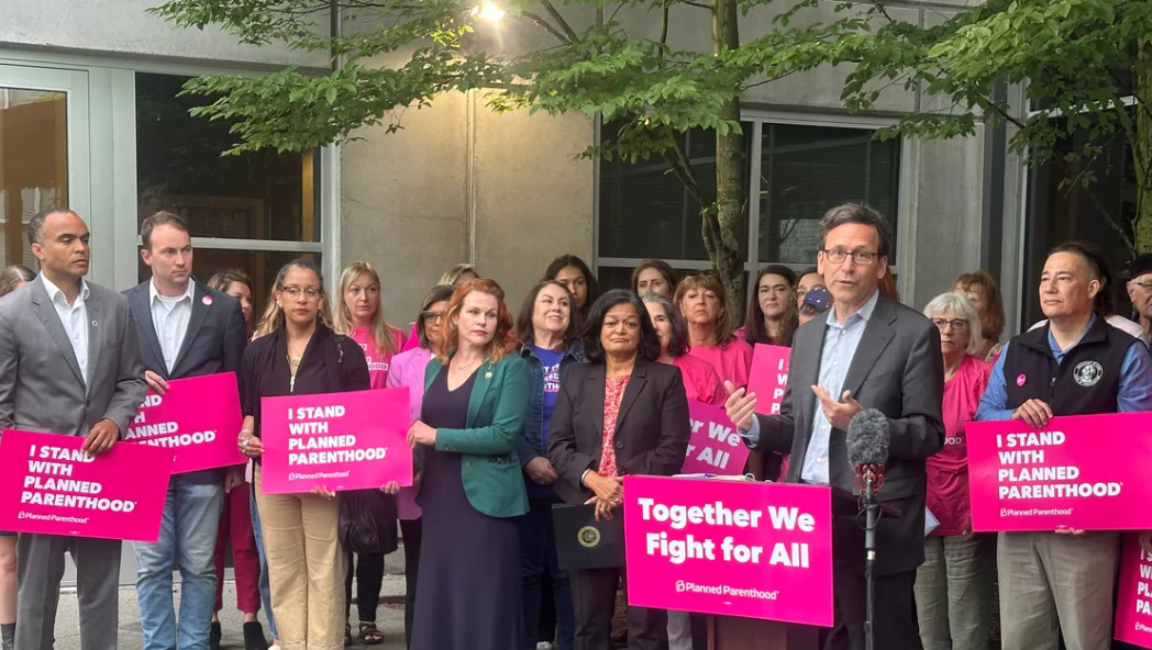 Gov. Bob Ferguson discusses a plan to backfill lost federal funding for Planned Parenthood with state funds during a press conference in Seattle on Wednesday, July 9. (Mitchell Roland/THE SPOKESMAN-REVIEW)