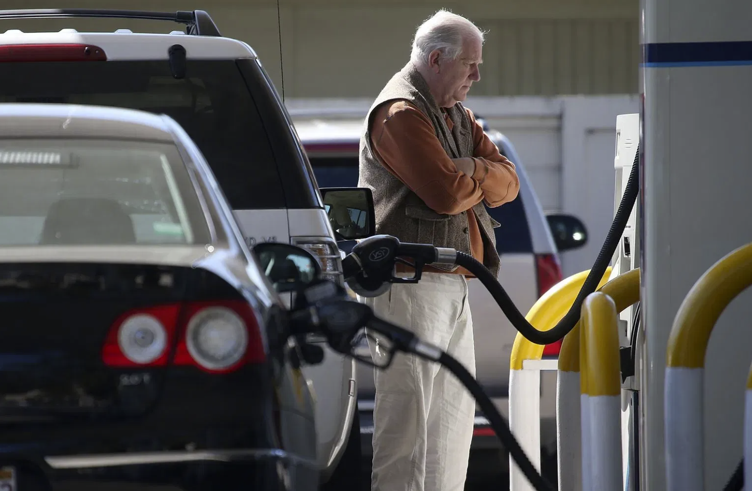 The national average for a regular gallon of gas is approximately $3.20, while Washington drivers are paying $1.65 more on average. FILE - A customer pumps gasoline into his car. (Photo by Justin Sullivan/Getty Images)