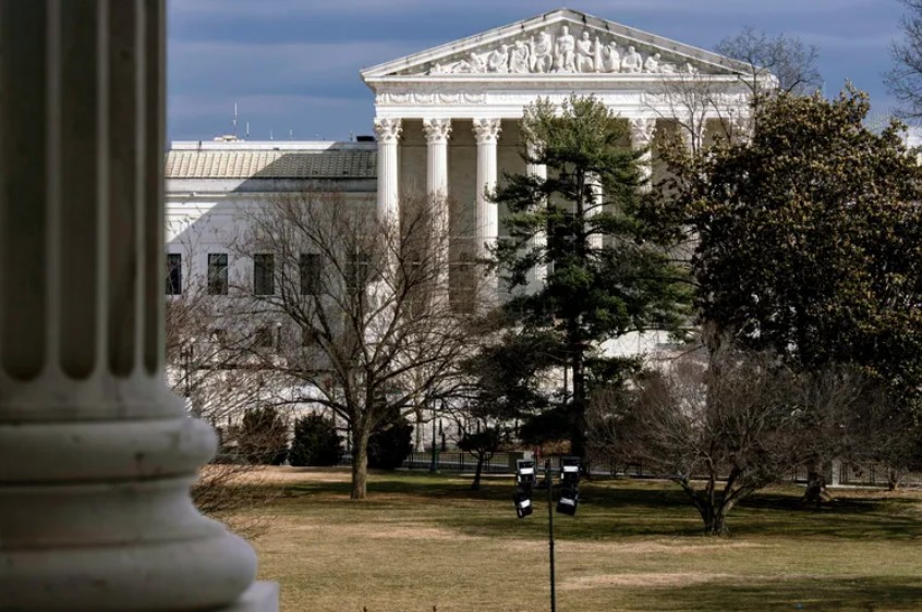 The Supreme Court is framed through columns of the U.S. Senate, Feb. 20, 2025 at the Capitol in Washington. (J. Scott Applewhite / The Associated Press)