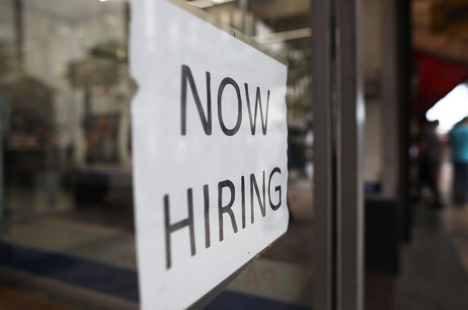 Now hiring sign. Getty Images.