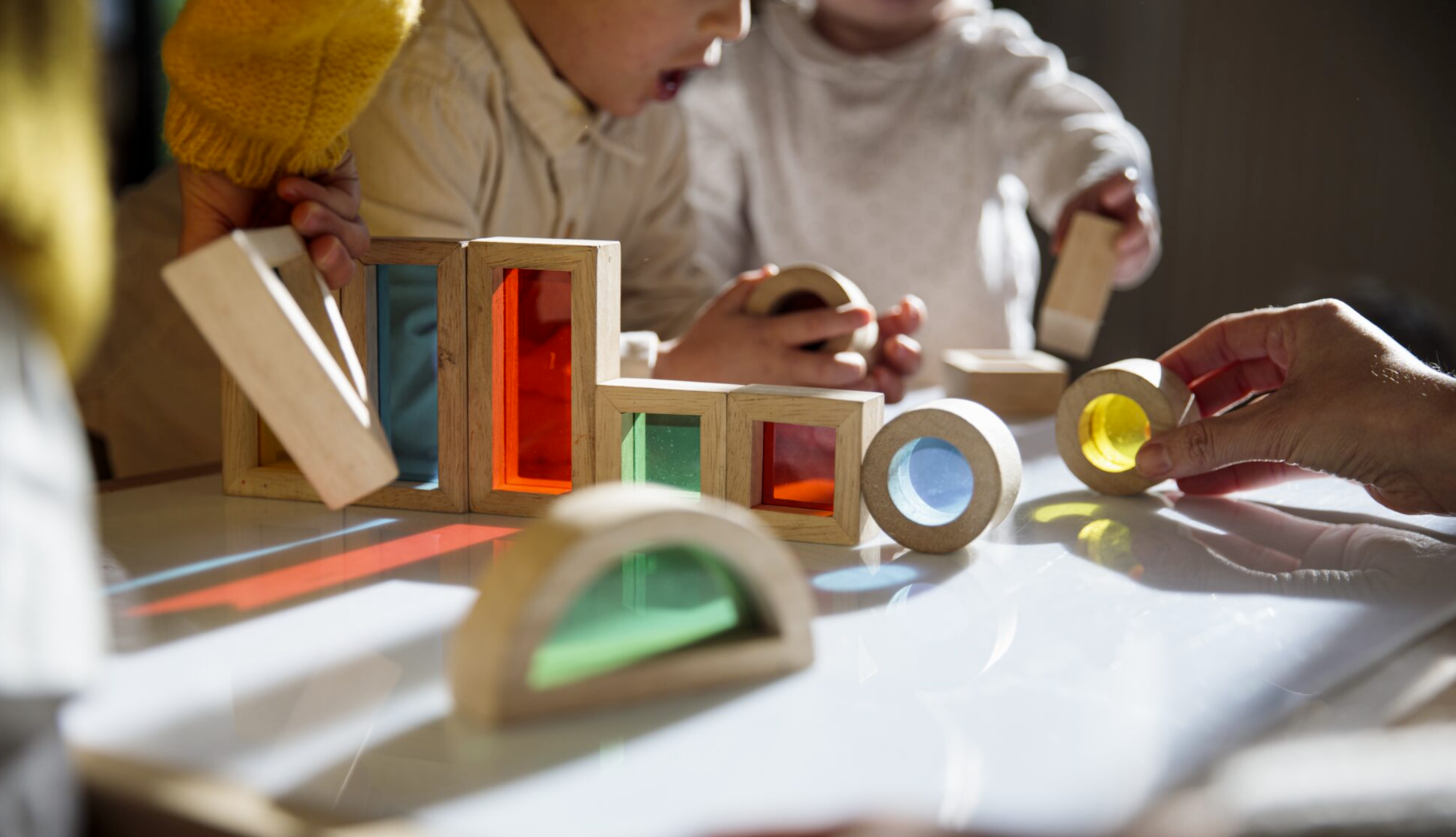 Children playing with colorful wooden building blocks. (Getty Images)