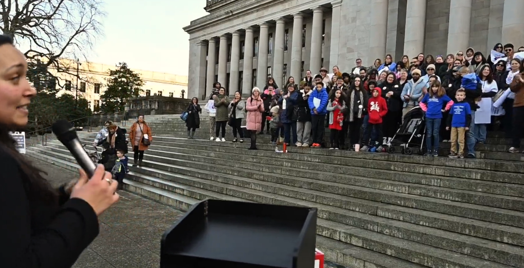 A student at Tacoma Community College and a parent Bronti Lemke shares what the importance of the ECAP program has been to her while addressing supporters at a Child Care for WA rally Wednesday at the Capitol campus. Other speakers included Tana Senn, Secretary of the Department of Children, Youth and Families along with other child care advocates. By Steve Bloom