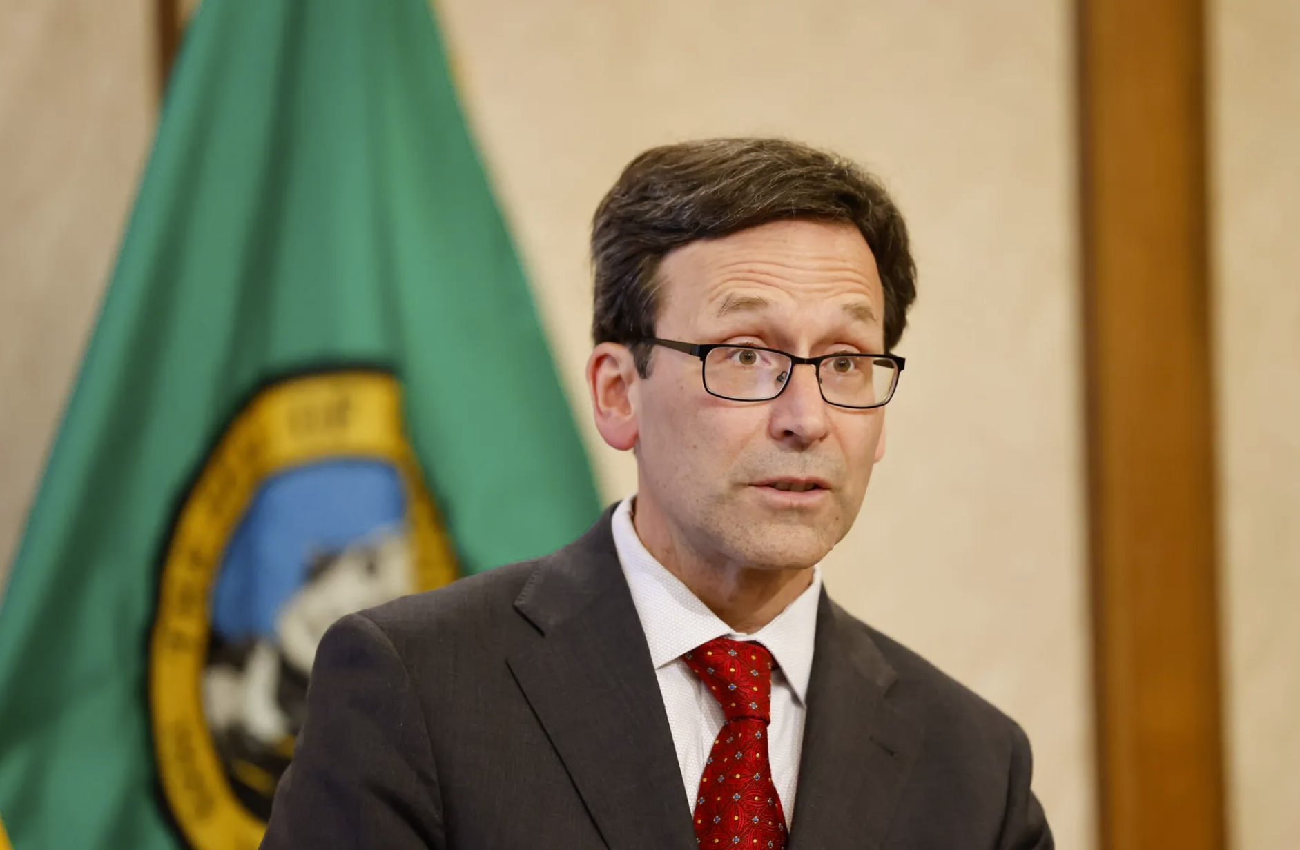 Gov. Bob Ferguson speaks to the press in the Governor’s Conference Room at the Washington State Capitol in Olympia on May 20, 2025. (Karen Ducey / The Seattle Times)