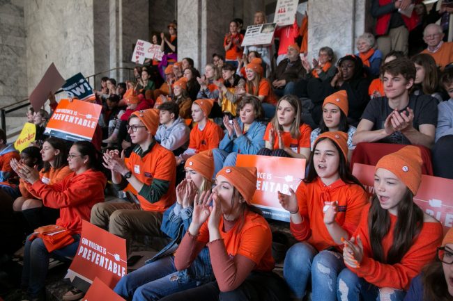 Students rally in the capital building for gun safety