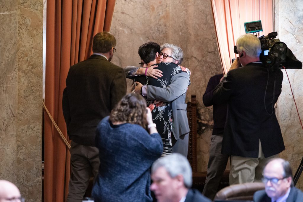 Rep. Jinkins and Rachel Smith embrace after passage of HB 1099