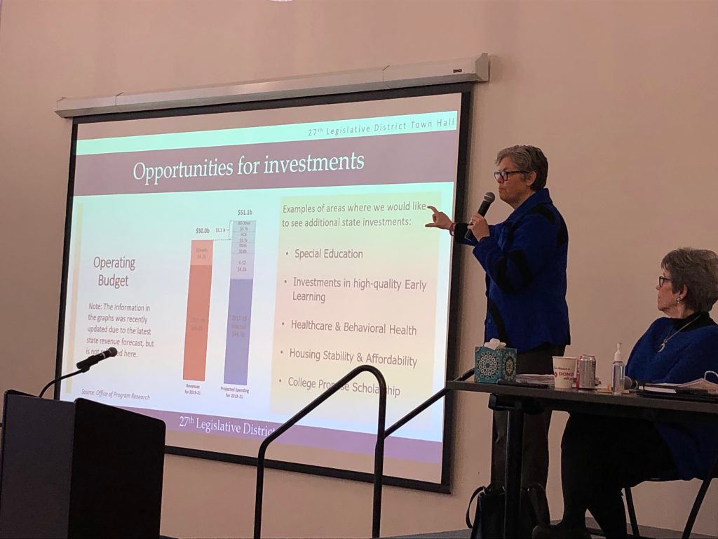 Rep. Jinkins pointing at budget slide at town hall meeting