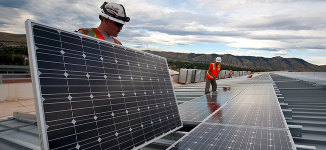 workers installing solar panels