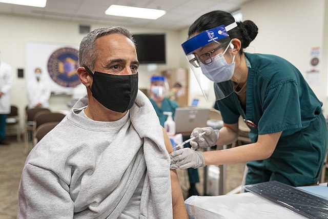 man getting Covid-19 vaccine